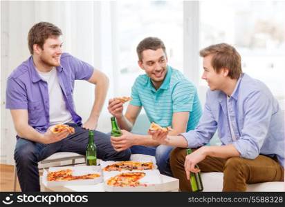 friendship, food and leisure concept - smiling male friends with beer and pizza hanging out at home