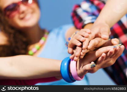 Friendship gesture. Group of young happy people. Unity concept