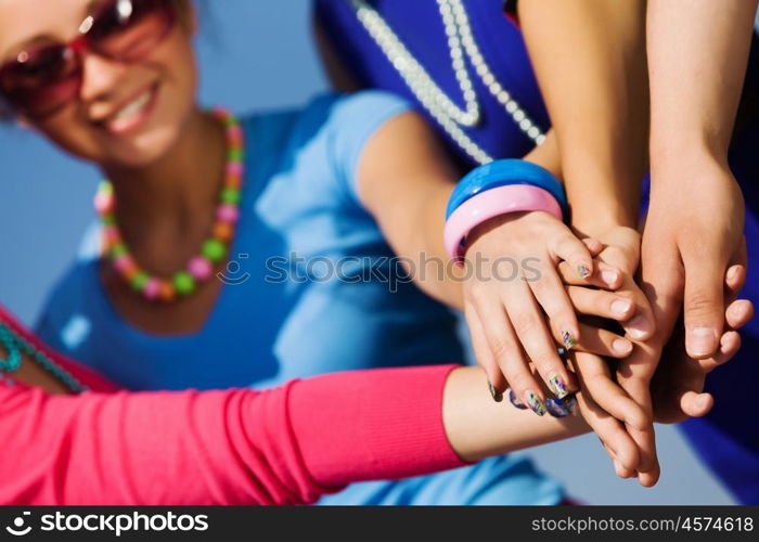 Friendship gesture. Group of young happy people. Unity concept