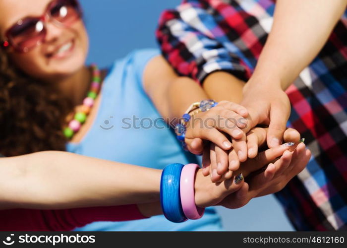 Friendship gesture. Group of young happy people. Unity concept