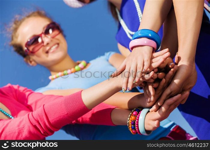 Friendship gesture. Group of young happy people. Unity concept