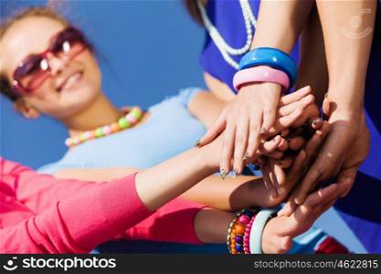 Friendship gesture. Group of young happy people. Unity concept