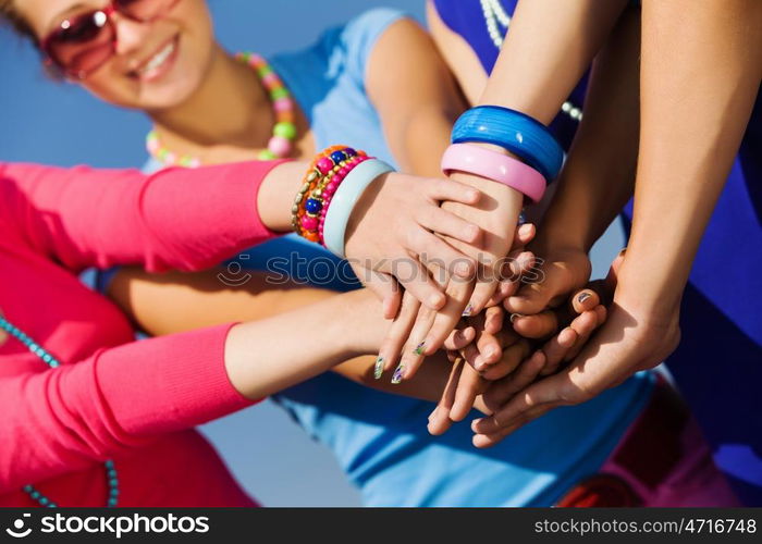 Friendship gesture. Group of young happy people. Unity concept