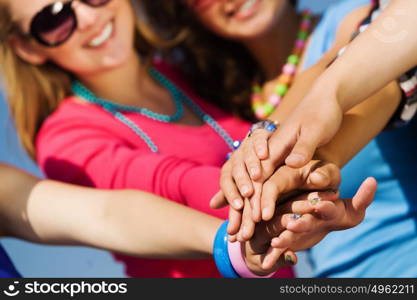 Friendship gesture. Group of young happy people. Unity concept