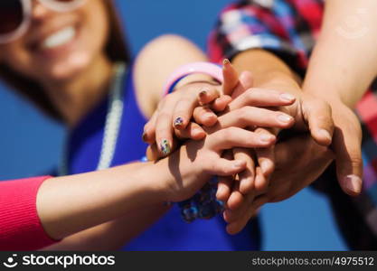 Friendship gesture. Group of young happy people. Unity concept