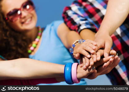 Friendship gesture. Group of young happy people. Unity concept