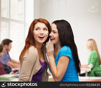 friendship, happiness and education concept - two smiling girls whispering gossip