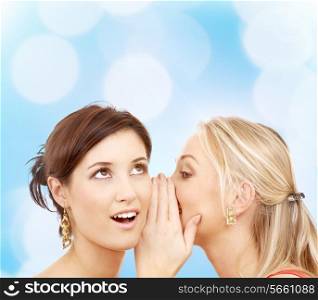 friendship, happiness and people concept - two smiling young women whispering gossip