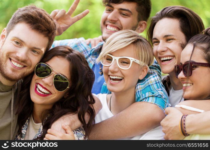 friendship, leisure and summer concept - group of happy smiling friends outdoors. group of happy smiling friends outdoors. group of happy smiling friends outdoors