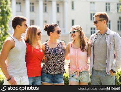 friendship, leisure, summer and people concept - group of smiling friends outdoors