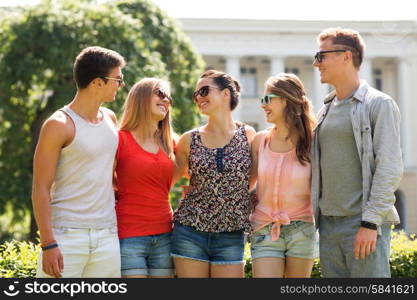 friendship, leisure, summer and people concept - group of smiling friends outdoors