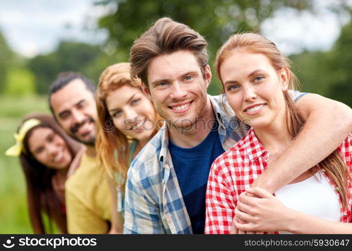 friendship, leisure, summer and people concept - group of smiling friends outdoors