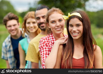 friendship, leisure, summer and people concept - group of smiling friends outdoors