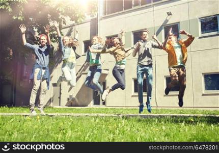 friendship, motion, action, freedom and people concept - group of happy teenage students or friends jumping outdoors. happy teenage students or friends jumping outdoors. happy teenage students or friends jumping outdoors