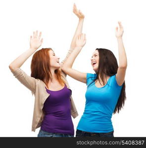 friendship, people and appiness concept - two happy dancing girls