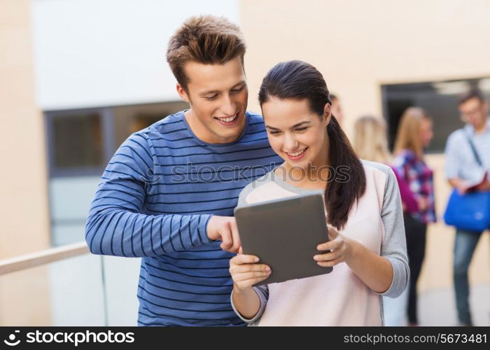 friendship, people, technology and education concept - group of smiling students with tablet pc computer outdoors