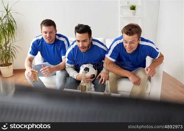 friendship, sport, people and entertainment concept - happy male friends or football fans with beer watching soccer at home