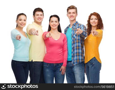 friendship, youth and people concept - group of smiling teenagers pointing fingers on you