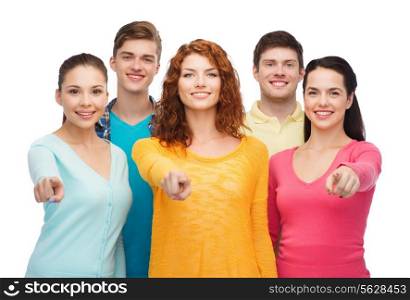 friendship, youth and people concept - group of smiling teenagers pointing fingers on you
