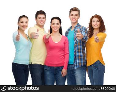 friendship, youth and people concept - group of smiling teenagers showing thumbs up