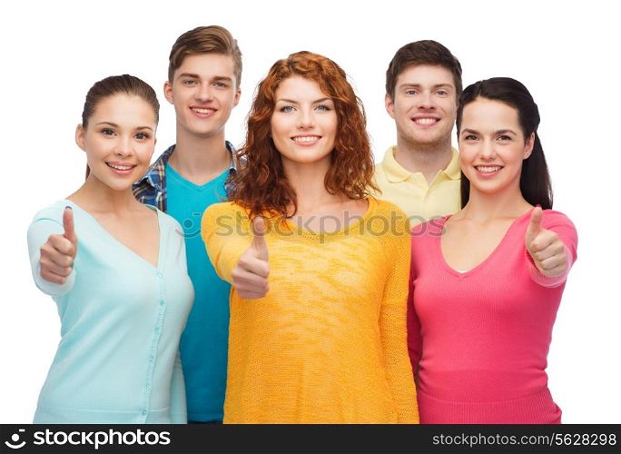 friendship, youth and people concept - group of smiling teenagers showing thumbs up