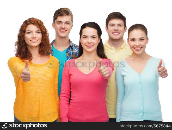 friendship, youth and people concept - group of smiling teenagers showing thumbs up