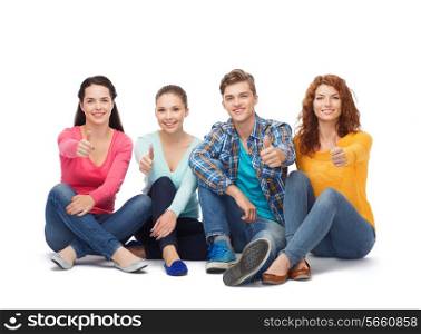 friendship, youth and people - group of smiling teenagers showing thumbs up