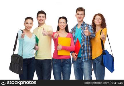 friendship, youth, education and people concept - group of smiling teenagers with folders and school bags showing thumbs up