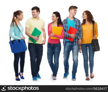 friendship, youth, education and people - group of smiling teenagers with folders and bags