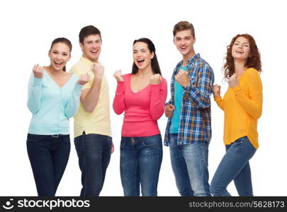 friendship, youth, gesture and people concept - group of smiling teenagers showing triumph gesture