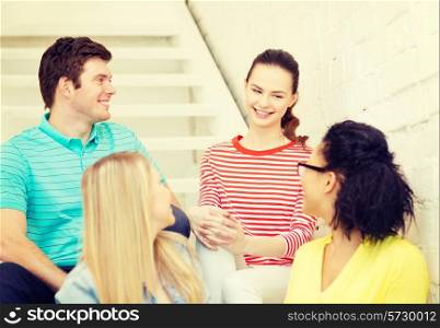 frienship and education concept - smiling teenagers hanging out