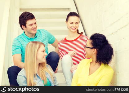 frienship and education concept - smiling teenagers hanging out