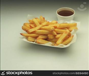 fries/chips in a takeaway tray