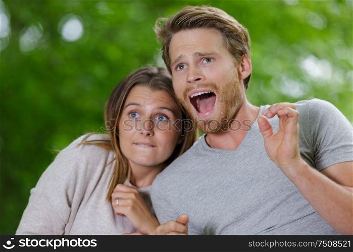 frightened young couple in nature