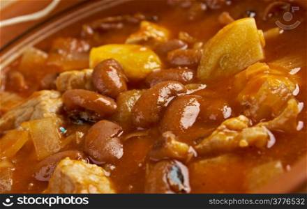 Frijoles Charros - traditional Mexican dish. by pinto beans stewed with onion, garlic, and bacon.