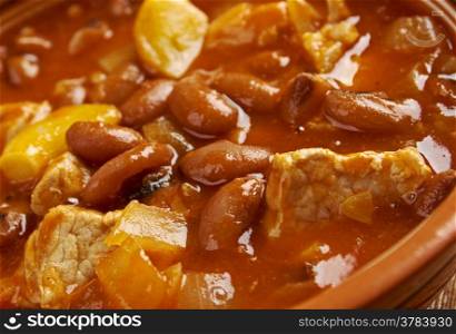 Frijoles Charros - traditional Mexican dish. by pinto beans stewed with onion, garlic, and bacon.