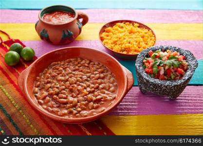 Frijoles mexican beans with rice and sauces nopal and pico de gallo