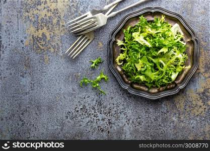 Frize lettuce salad, fresh frisee. Healthy vegetarian food