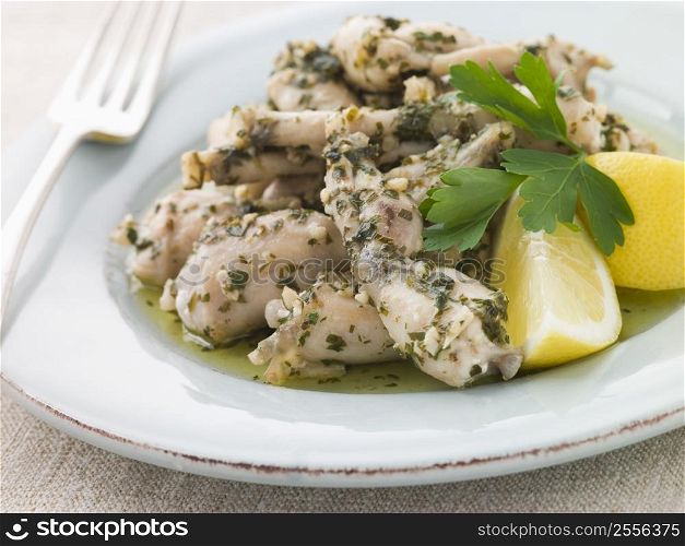 Frogs Legs Fried in Garlic and Herb Butter with Lemon