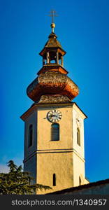 Frohnleiten, Styria, Austria 08.01.2020 - church tower above above Mur river in Styria,Austria. View at Parish church, town and river Mur. Famous travel destination.. Frohnleiten church tovwer above Mur river in Styria,Austria. Famous travel destination.