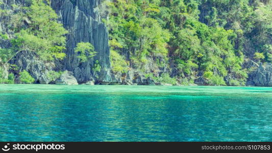 from a boat in philippines snake island near el nido palawan beautiful panorama coastline sea and rock