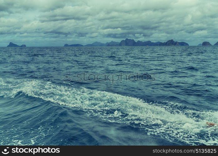 from a boat in philippines snake island near el nido palawan beautiful panorama coastline sea and rock