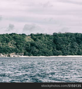 from a boat in philippines snake island near el nido palawan beautiful panorama coastline sea and rock