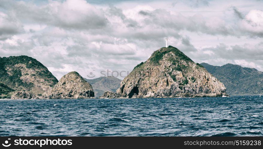 from a boat in philippines snake island near el nido palawan beautiful panorama coastline sea and rock