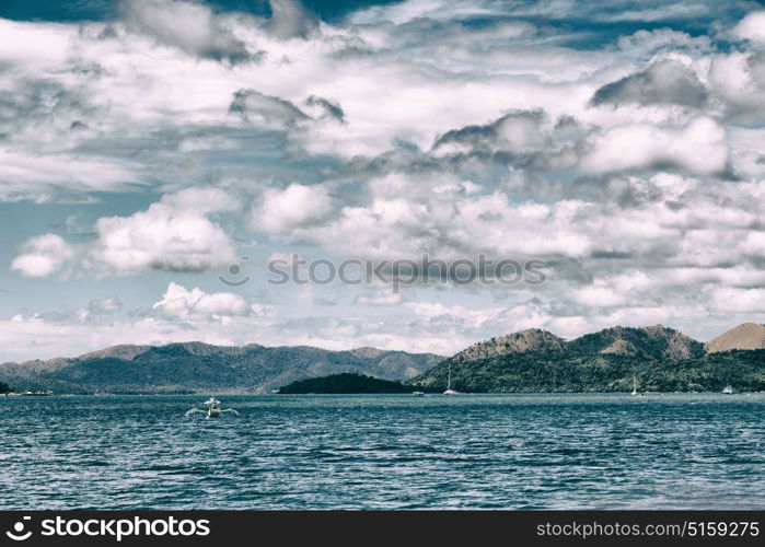 from a boat in philippines snake island near el nido palawan beautiful panorama coastline sea and rock