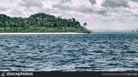 from a boat in philippines snake island near el nido palawan beautiful panorama coastline sea and rock