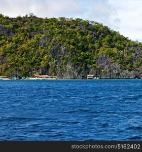 from a boat in philippines snake island near el nido palawan beautiful panorama coastline sea and rock