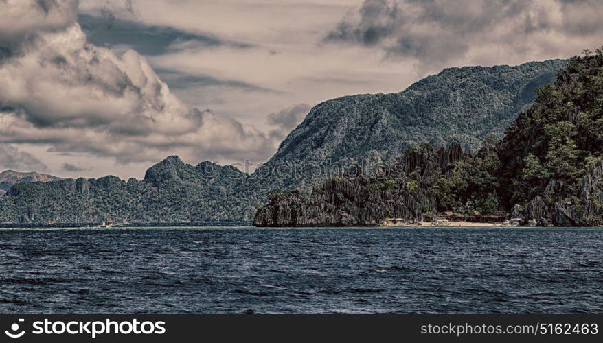 from a boat in philippines snake island near el nido palawan beautiful panorama coastline sea and rock