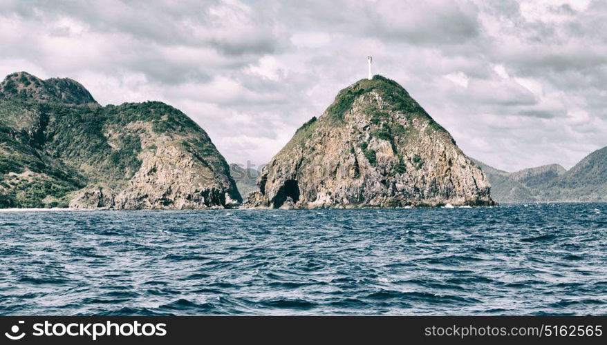 from a boat in philippines snake island near el nido palawan beautiful panorama coastline sea and rock