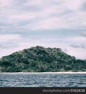 from a boat in philippines snake island near el nido palawan beautiful panorama coastline sea and rock